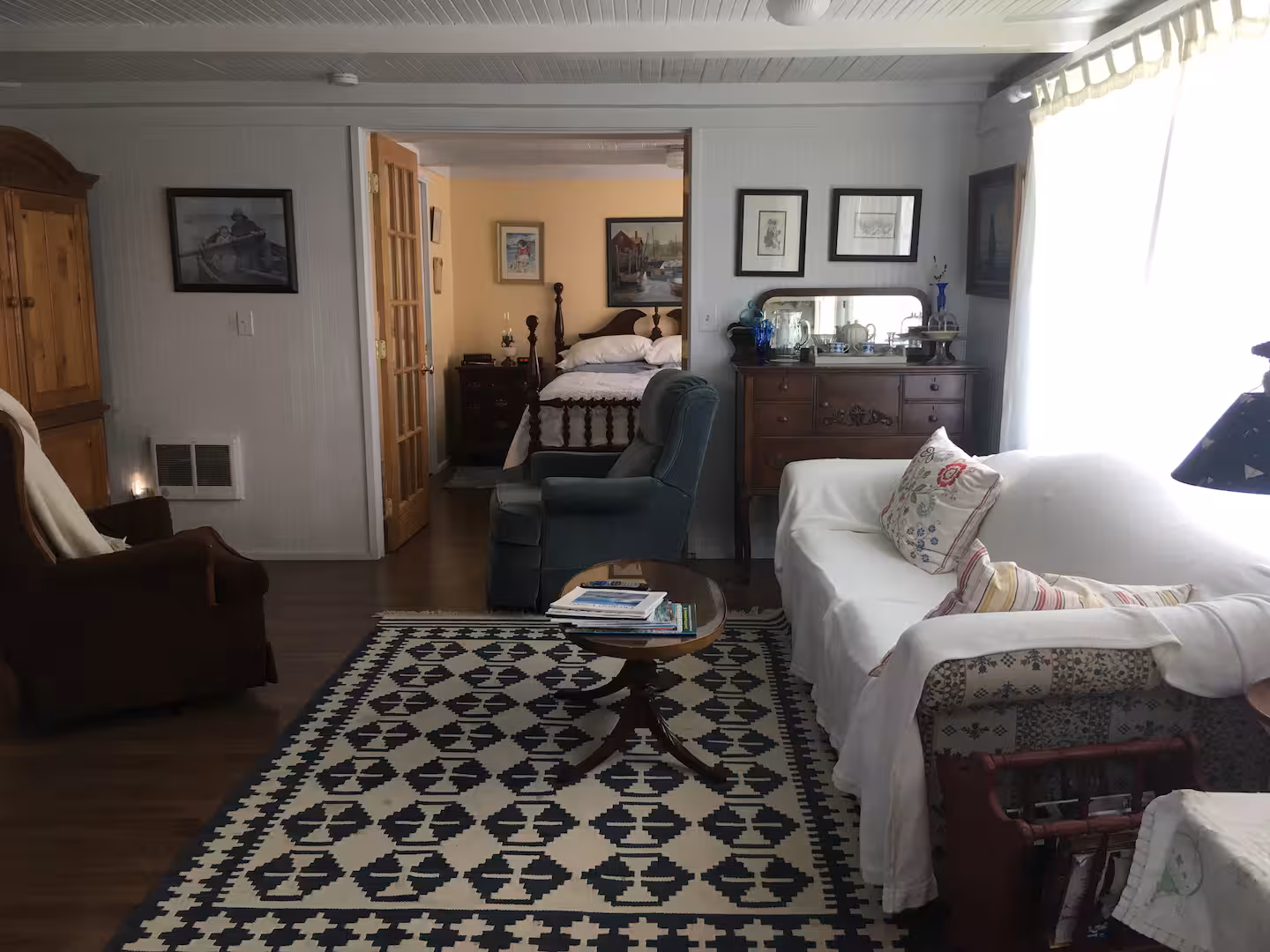 Wide view of the living room, looking through to the bedroom